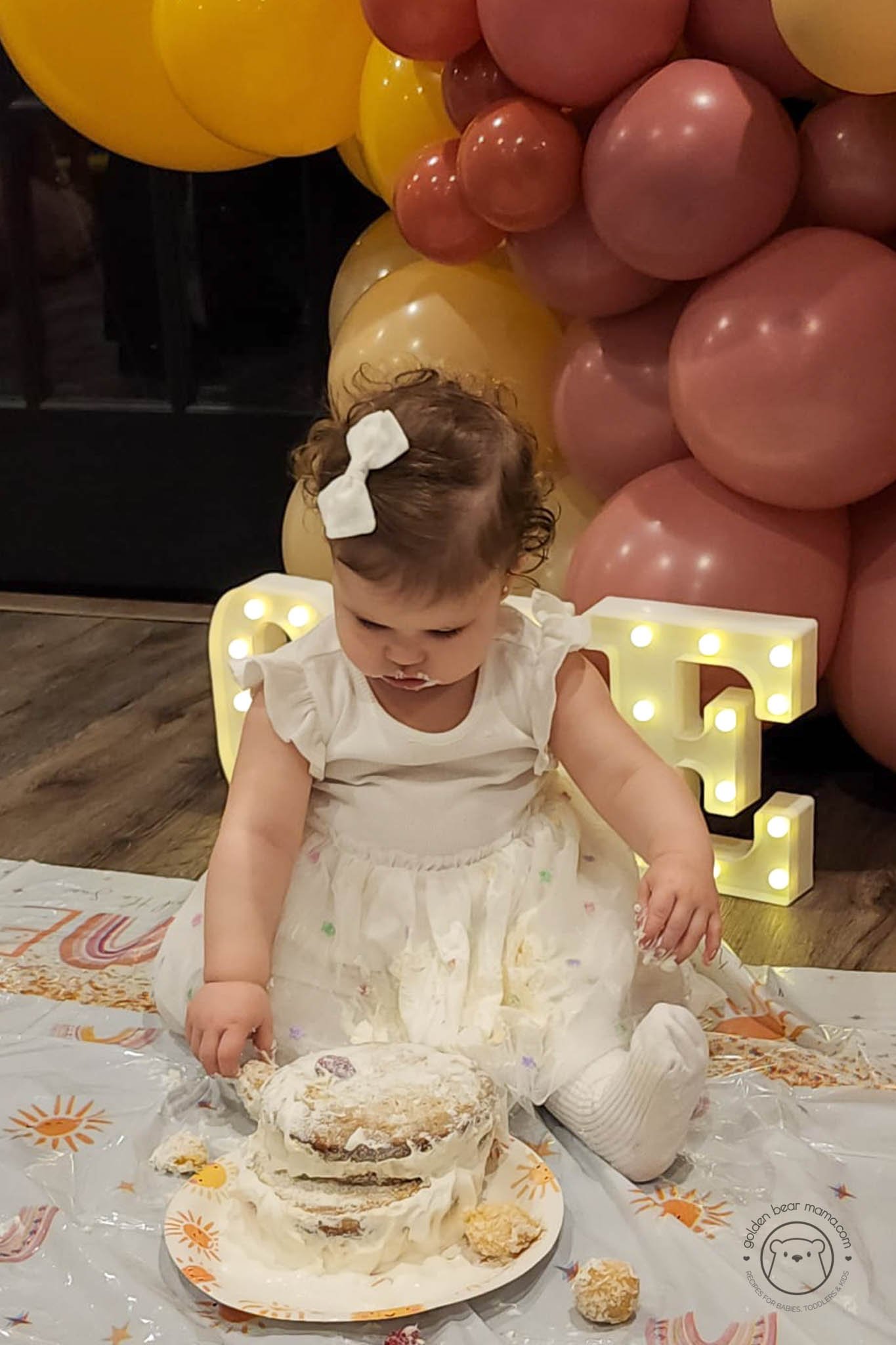 Baby looking at smash cake